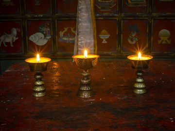 Altar with butter lamps in Buddhist monastery in Ghiling, Mustang, Nepal