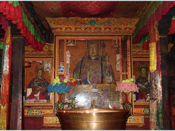 Altar with Guru Padmasambhava in Dzogchen Gompa.