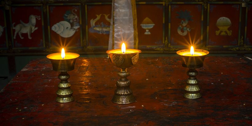 Altar with butter lamps in Buddhist monastery in Ghiling, Mustang, Nepal
